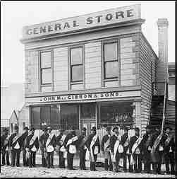 Oddfellows march past the MacGibbon general store